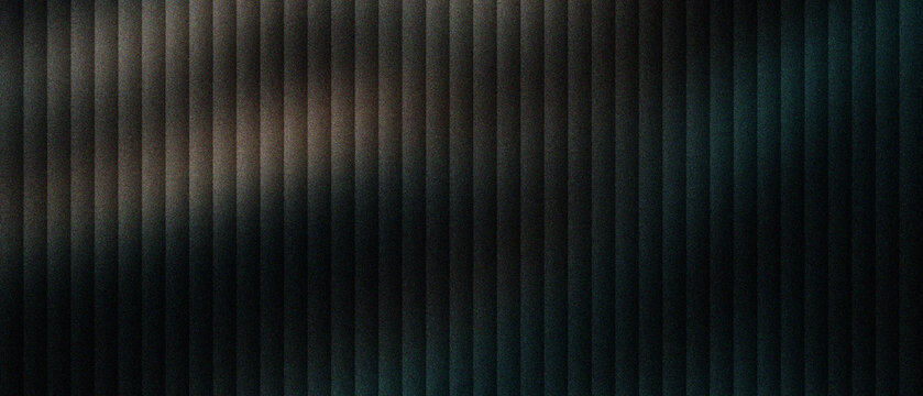 Industrial metal texture with vertical ridges and dark metallic finish. Brushed steel surface featuring rhythmic parallel lines and soft light reflections. Modern architectural panel background.
