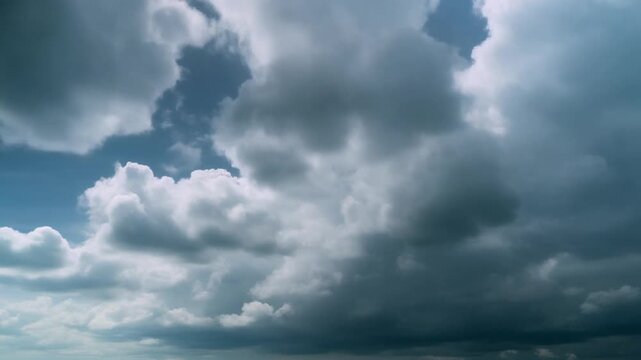 Dramatic expanse of dark, brooding storm clouds gathering across the vast sky, signaling an imminent weather shift and atmospheric change