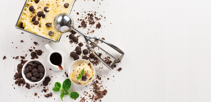 Trendy stracciatella gelato ice cream with dark chocolate chips in minimalist composition on white background premium artisan vanilla dessert aesthetic