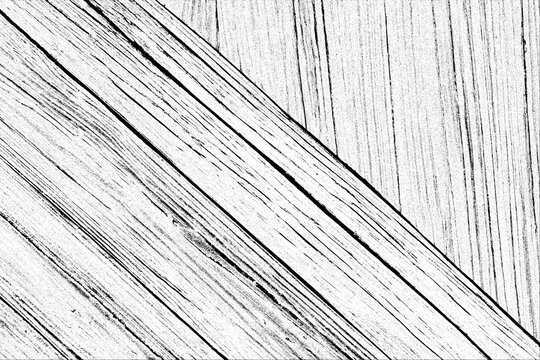 Detailed close up view showcases the distinct grain patterns and textured surface of weathered wooden planks arranged diagonally across the frame, emphasizing their linear structure.