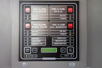 Marine Fire Alarm Control Panel on Ship. Multi-Zone Safety System with Status Indicators, LCD Display and Emergency Alert Controls on Vessel © dechevm