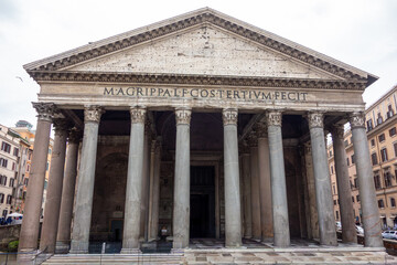 Obraz premium The iconic facade of the Pantheon in Rome, Italy. A famous ancient Roman temple with magnificent Corinthian columns, a major historic landmark and popular European travel destination.