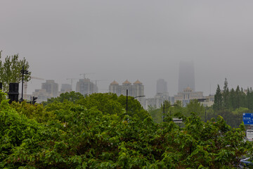 Fototapeta premium 18 April 2026 Fog low clouds surrounding the Buildings over Shanghai the Bund in China with the highrise towers on the Huangpu River
