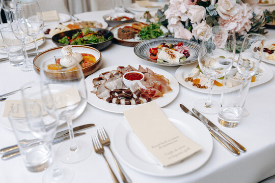 Casual upscale event featuring diverse appetizer service setup