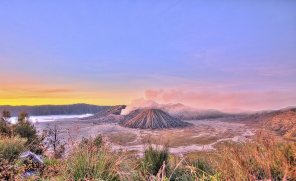 Sunrise, smoking Mount Bromo, Mt. Batok at front, Mt. Kursi at back, Mt. Gunung Semeru, Bromo Tengger Semeru National Park, Java, Indonesia
