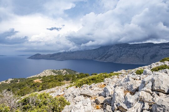 View over the island and coast to the sea, rocky landscape with macchia, Symi, Dodecanese, Greece