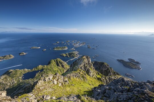 View of fishing village Henningsvaer from the top of Festv&aring;gtinden, Small islands connected by road and bridges, Austv&aring;g&oslash;ya, Lofoten, Norway