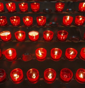 Burning votive candles in a church, Munich, Upper Bavaria, Bavaria, Germany