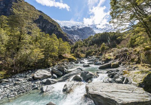 Glacial river flowing through mountains, Rob Roy Glacier, Mount Aspiring National Park, Otago, Southland, New Zealand