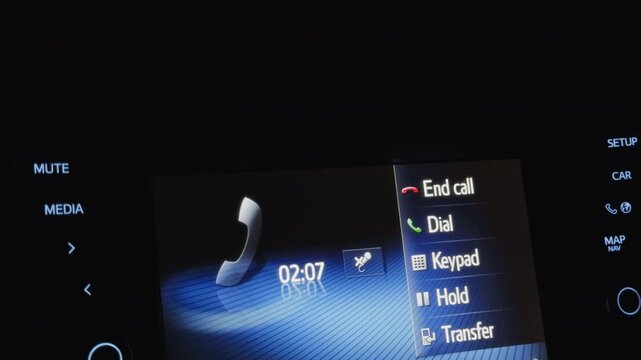 Vehicle call interface. Modern car dashboard with glowing icons for calling functions in low light