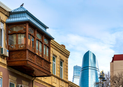 Traditional Wooden Balcony and Flame Towers