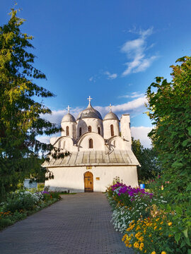 Ancient orthodox christian Cathedral of Ioann Predtecha (John the Precursor). Pskov, Russia. Russian temple. Old architecture. Cross. Text Translation: Christ is Risen. Twelfth-century stone church