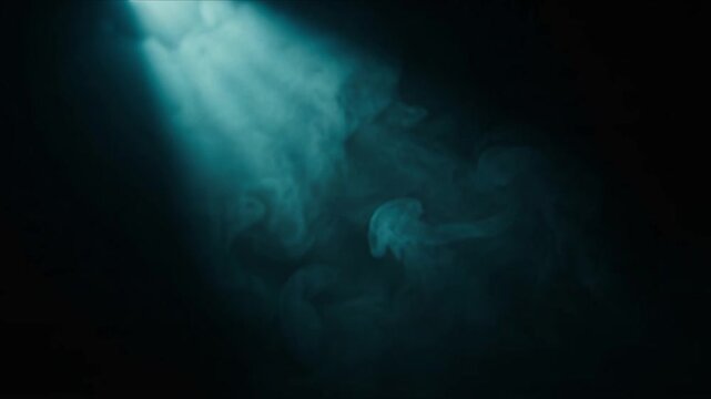 Cyan Volumetric Light Beam Descending Through Dark Atmospheric Fog