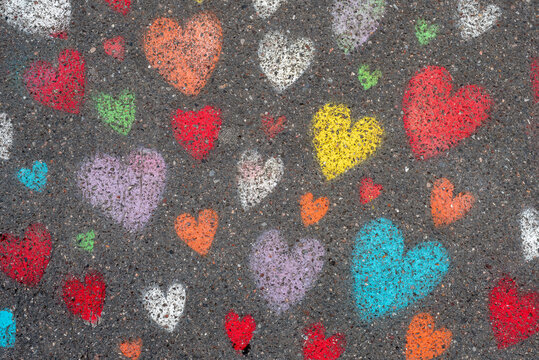 Cute colourful hearts drawn on a pavement in Paris. 