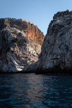 Vertical View of Steep Rocky Cliffs and Sea in Alanya Turkey