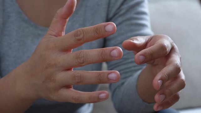 trembling hand due to Parkinson's disease. with wrist pain, arthritis and inflammation with carpal tunnel syndrome. Health care concept.