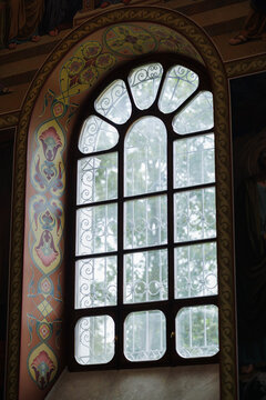 Elegant arched window featuring artistic painted murals