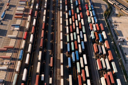 Drone view of freight trains and containers in rail yard
