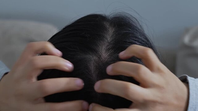 A woman has problems with hair and  itchy scalp, she has dandruff from allergic reactions to shampoos. and hair conditioner. 