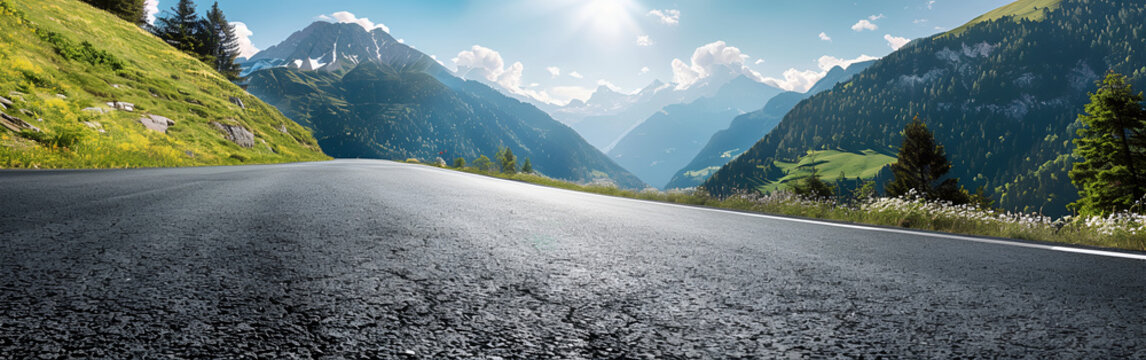 Scenic mountain road leading through a valley towards majestic peaks with mountain landscape transport adventure exploration direction