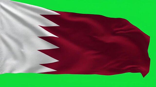 A maroon and white flag with a zig-zag pattern waves