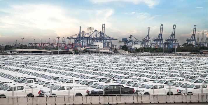 New cars parked at the port for global export and logistics industry business.