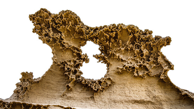 Porous sandstone rock formation with natural hole, isolated on transparent background