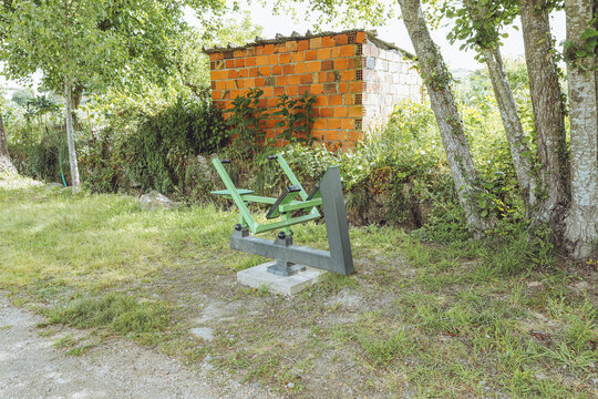 Rowing Machine (Rowing Simulator) - Outdoor Gym, Santa Comba D&atilde;o, Portugal, public fitness Calisthenics equipment in a green park environment