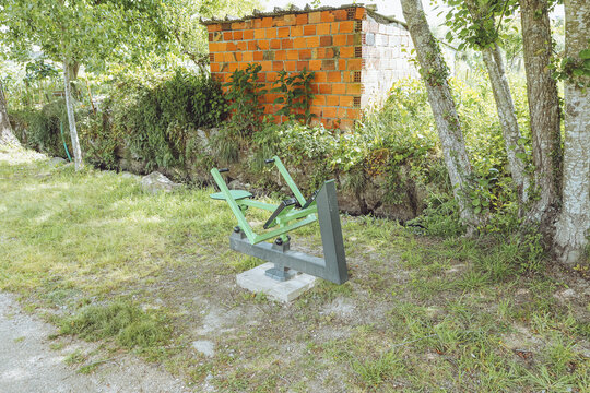 Rowing Machine (Rowing Simulator) - Outdoor Gym, Santa Comba D&atilde;o, Portugal, public fitness Calisthenics equipment in a green park environment