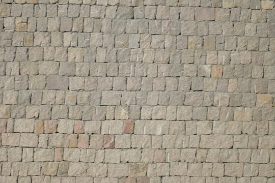 Rough stacked stone wall background texture
