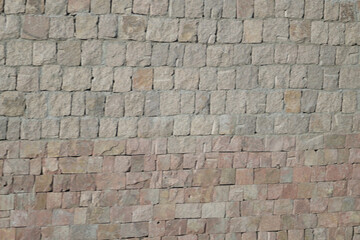 Naklejka premium Rough stacked stone wall background texture