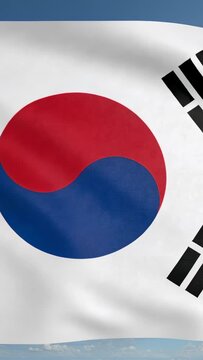 Vertical video: Waving South Korean Taegukgi flag rippling outside, breeze revealing black trigrams