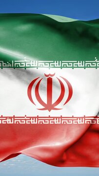Vertical video: Gust lifting tricolor flag flapping outdoors, revealing red emblem and Kufic script