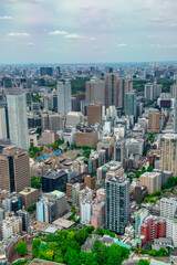 Fototapeta premium Aerial view of Tokyo Minato district skyscrapers from high viewpoint sunny day Japan