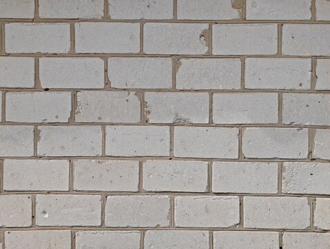 Textured rustic white silicate brick wall background close-up