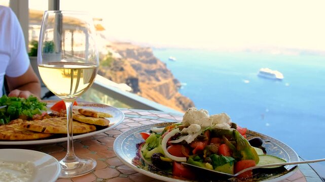 Greek salad and wine in Greece in a restaurant. Selective focus.