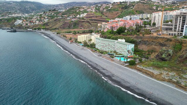 Panoramic perspective from a drone over Madeira&rsquo;s Doca do Cavacas with turquoise waters, docked yachts, and urban waterfront in vibrant detail