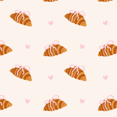 Fototapeta premium Croissant seamless pattern with bows on light background. Repeated French pastry print with golden croissants and pink ribbon knots for bakery cafe and textile design