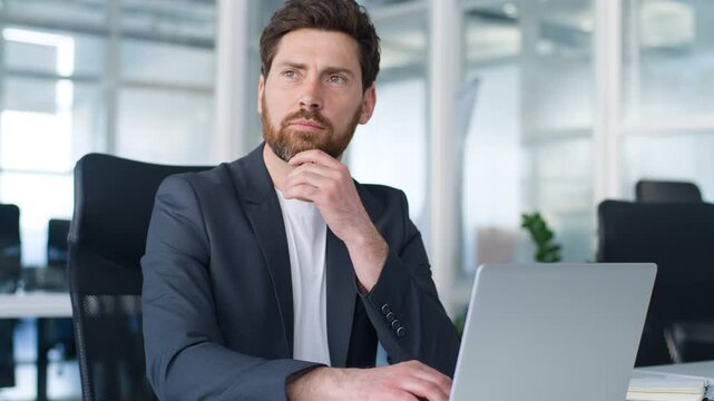 Concentrated dreamy Caucasian middle-aged business man thinking work solution focused looking away job decision mature businessman working with laptop technology 40s male think with computer in office