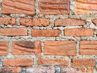 Obraz premium Red brick textures. Red soil brick wall textures. Rustic Brick Wall background. Grunge Red Brick Wall Surface Design. Vintage Soil Brick Wall Texture Graphic