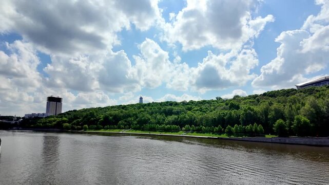 Russia. Moscow. May 16, 2026. Wide angle view of Moskva River and green Vorobyovy Gory hill