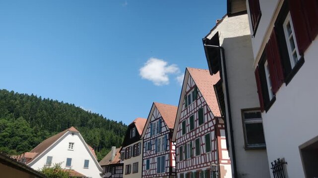 Traditional half-timbered houses in schiltach, a historic town in the black forest, baden-w&uuml;rttemberg, germany, showcasing medieval architecture against a clear blue summer sky