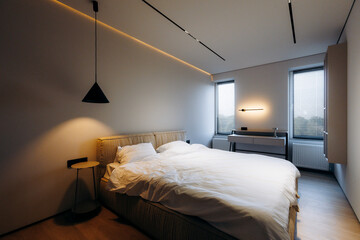 Tranquil modern bedroom with light accents and minimalist details © Kantemir Production