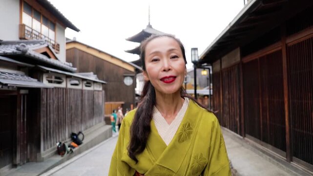 Elegant Japanese woman wearing a Kimono in the Nineizaka area of Kyoto Japan.