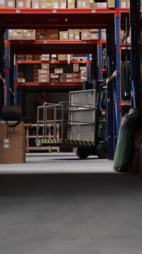 Large warehouse with high shelves stacked with cardboard boxes