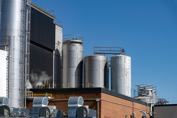 Obraz premium Stainless steel tanks in a dairy products manufacturer