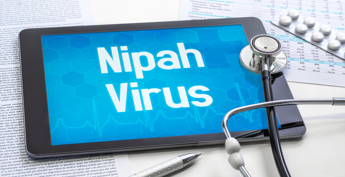 A tablet with text on the display - Nipah Virus