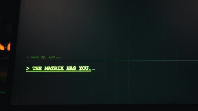 A glowing green computer terminal screen displays the letters wake up neo alongside falling digital rain code. Concept of cyberpunk hacking, virtual reality simulations, and sci-fi technology.