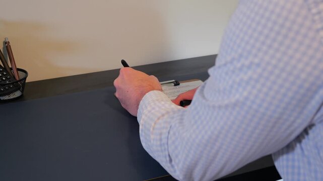 Concept - Government military documents marked Top Secret or Classified featuring lines of text blacked out with heavy ink marker edited redactions