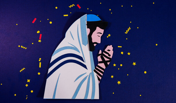 Jewish man praying with a tallit and tefillin. Handmade paper cutouts, including a traditional prayer shawl and tefillin straps. Teflilah.